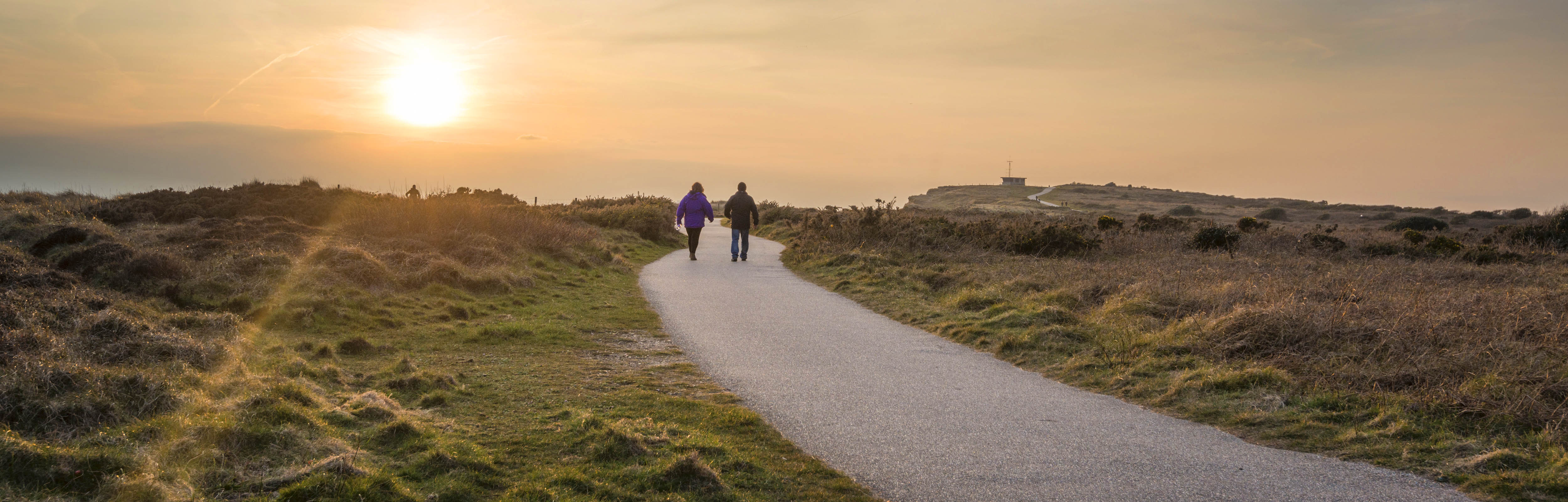 two people enjoying a walk at hengistbury head in Christchurch 